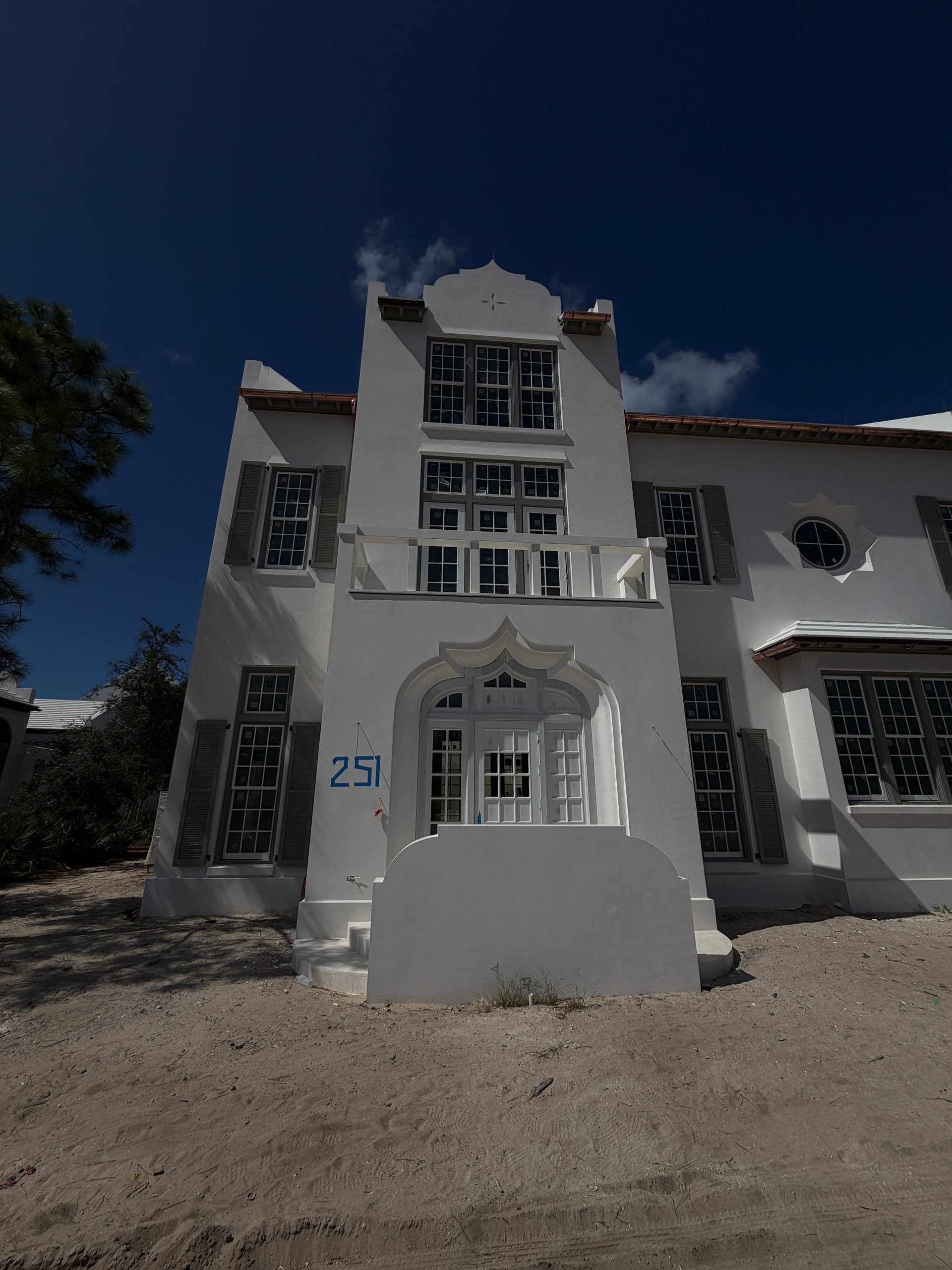 New residential construction and white coastal home in Alys Beach Florida