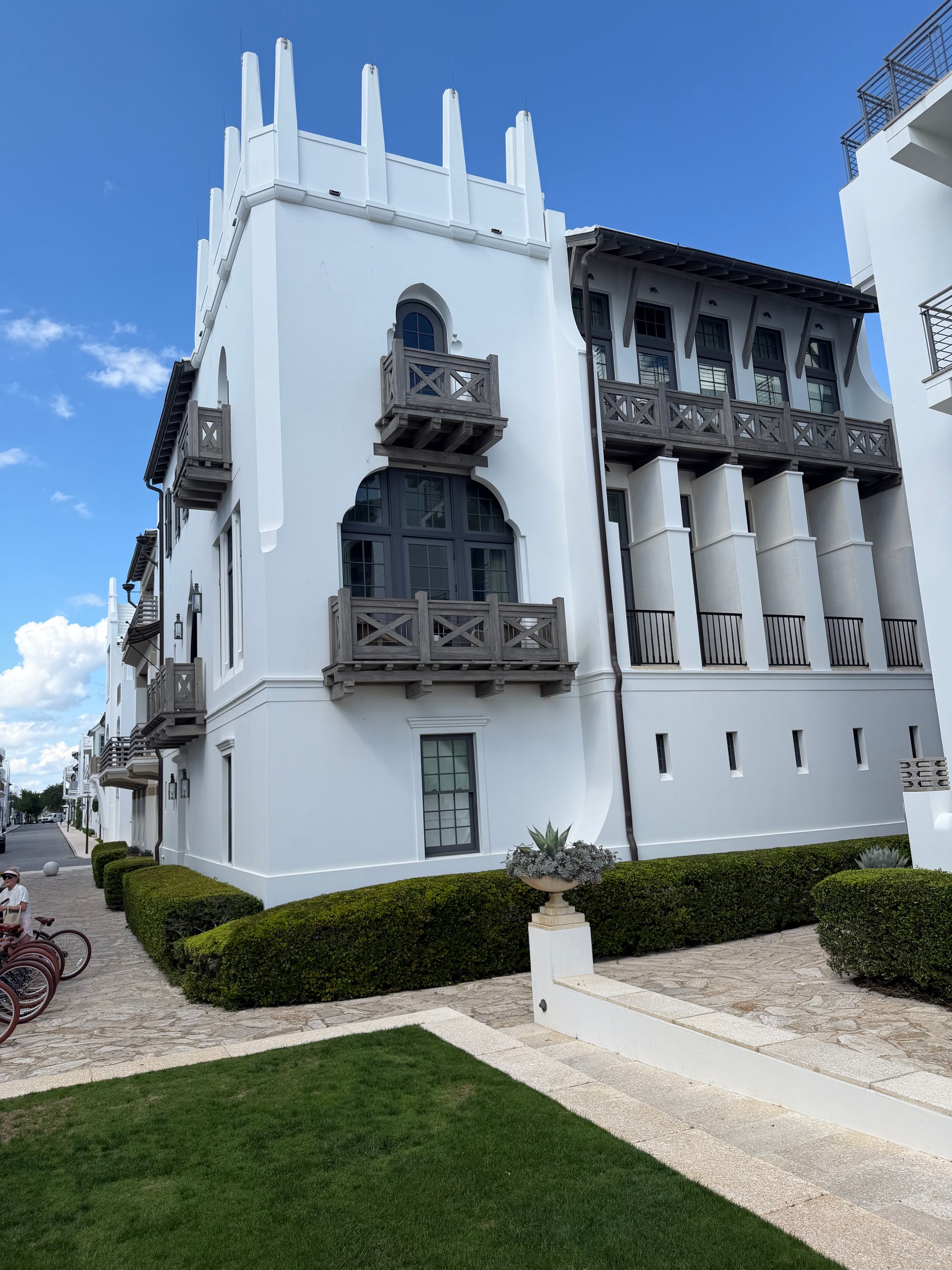 White stucco architecture and dark wooden balconies in Alys Beach Florida