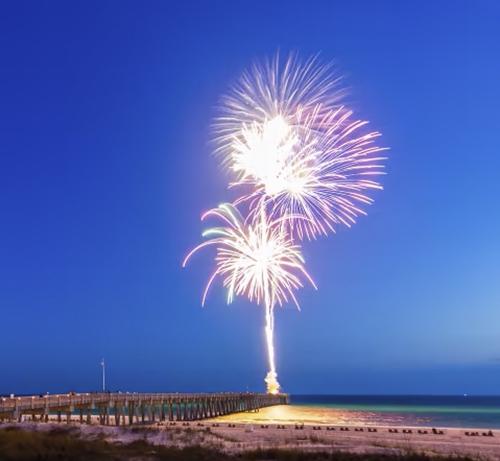 Fireworks launched from a pier in Panama City Beach Florida