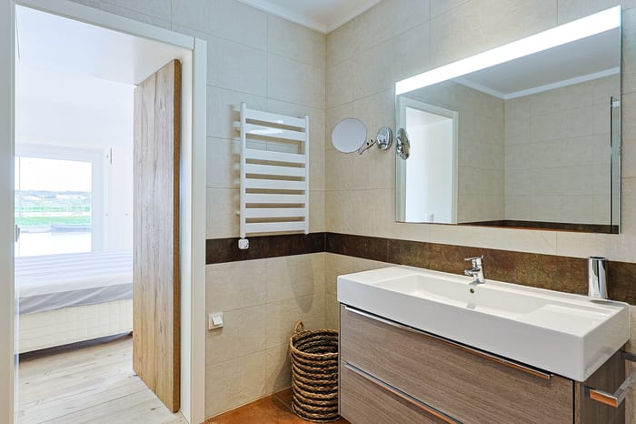 Bathroom vanity with heated towel rail