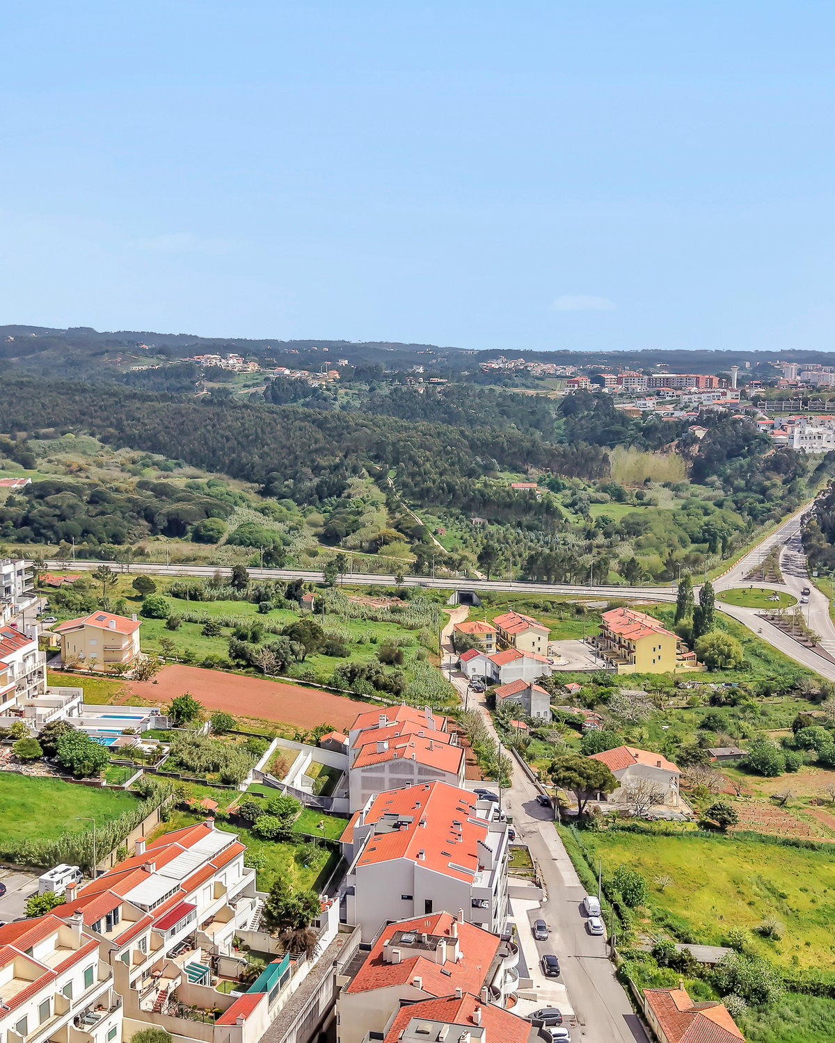 An aerial view inland from Figueira da Foz, toward the greener landscape of the Serra da Boa Viagem