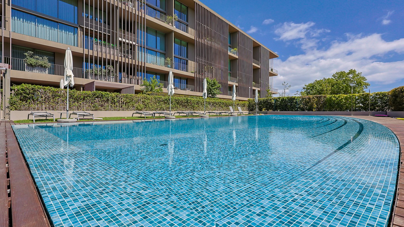 The pool and terrace at One Living Cascais