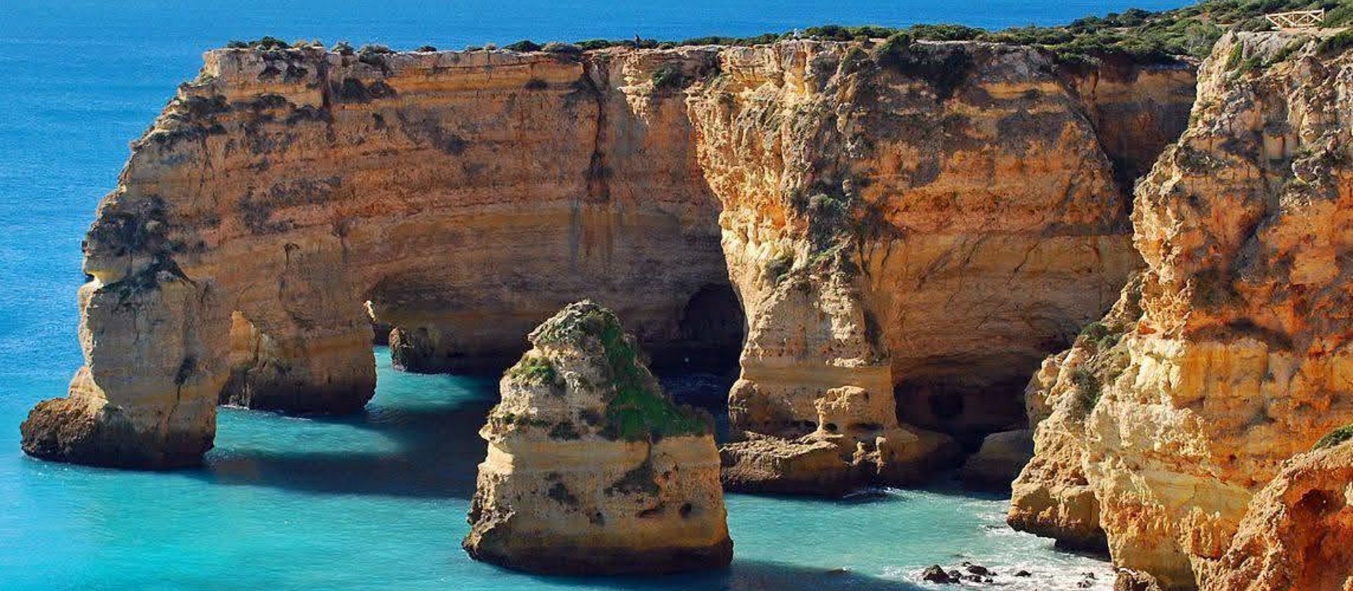 The limestone cliffs, sea arches and turquoise water of Praia da Marinha