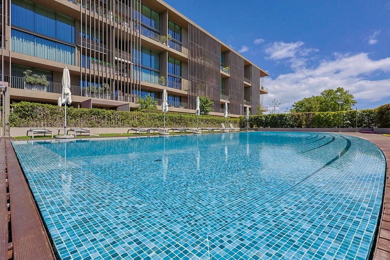 The pool and terrace at One Living Cascais