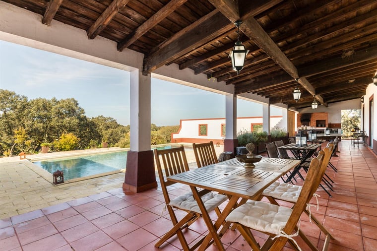 The shaded terrace and pool at the Avis estate