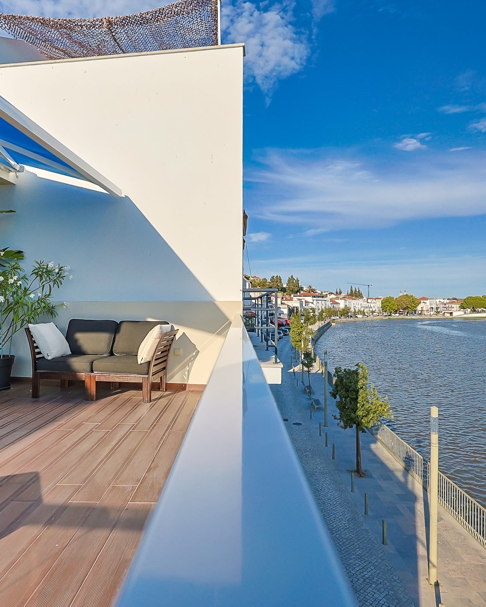 Terrace with Sado River views at a residence in historic Alc&aacute;cer do Sal