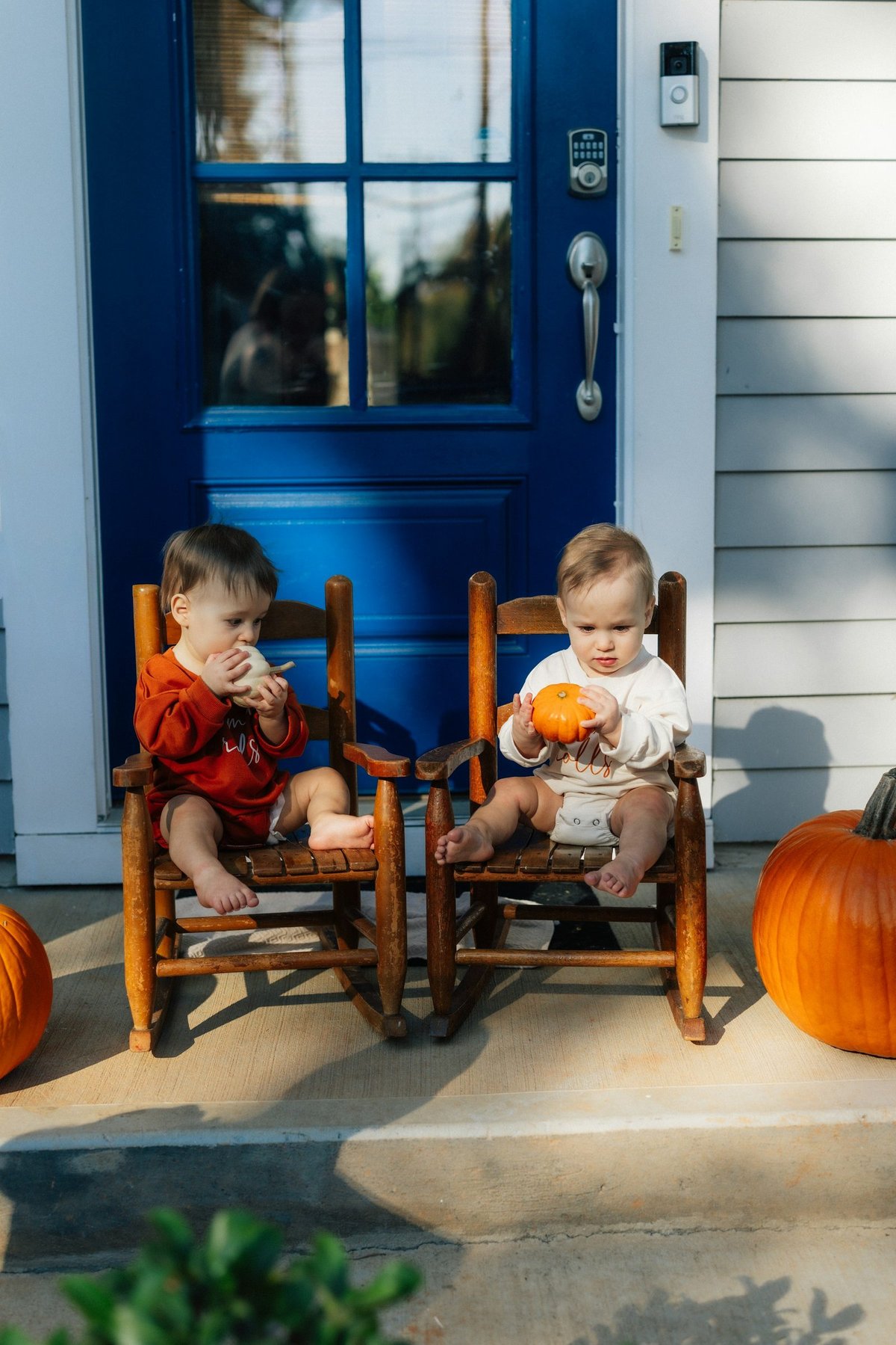 Children on the front porch of a family home