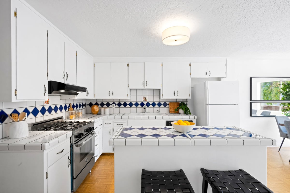 Kitchen with gas range and tile backsplash at 2269 Bryant Street Mission District San Francisco
