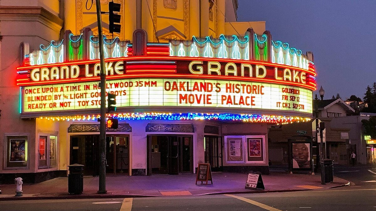 The Grand Lake Theater lit at night in Oakland California