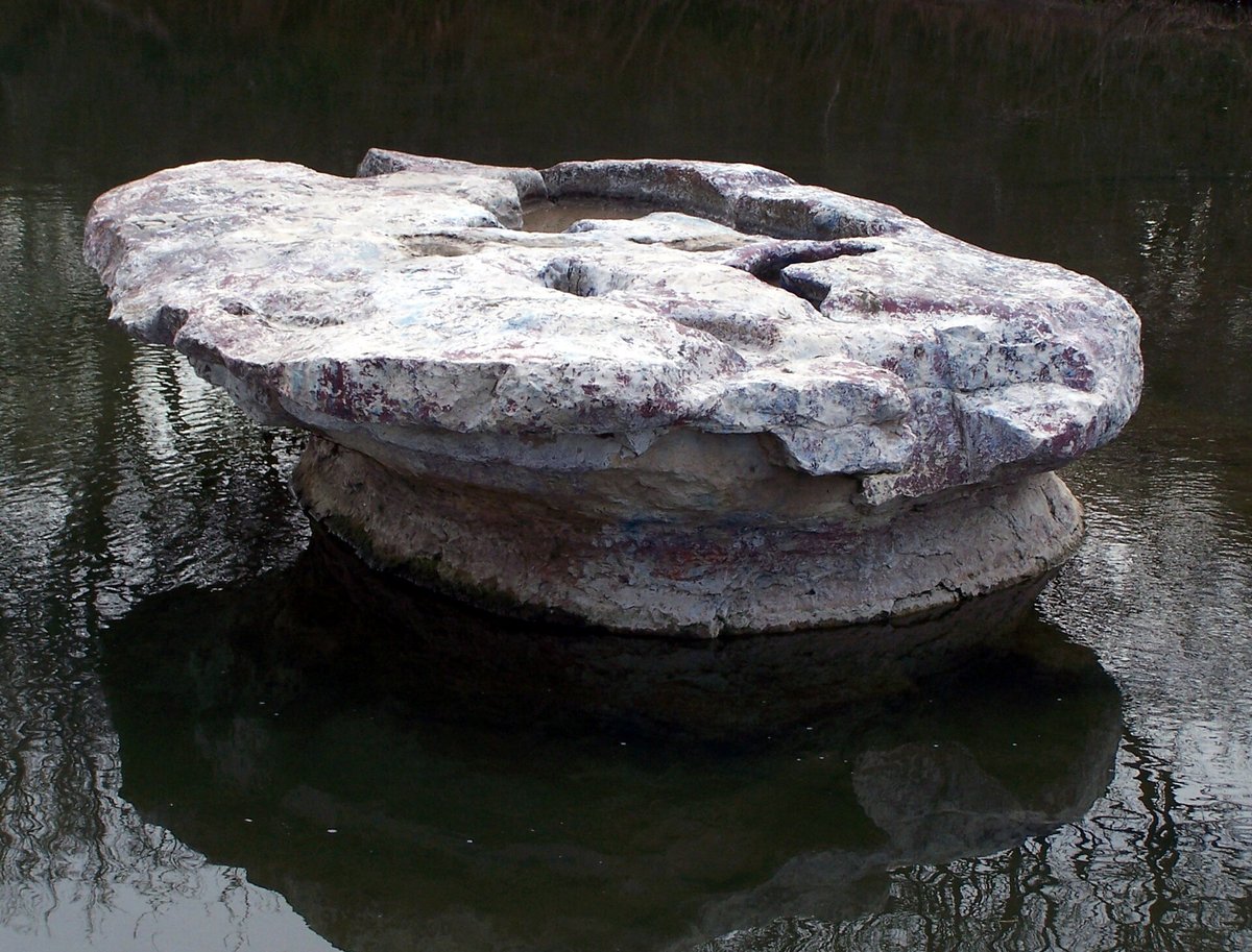 The Round Rock, a flat limestone slab in the bed of Brushy Creek in Round Rock, Texas