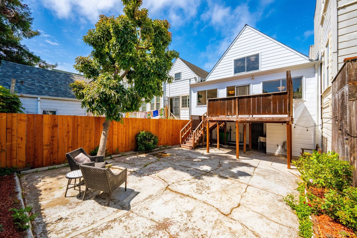 Paved rear patio and deck at 2269 Bryant Street Mission District San Francisco