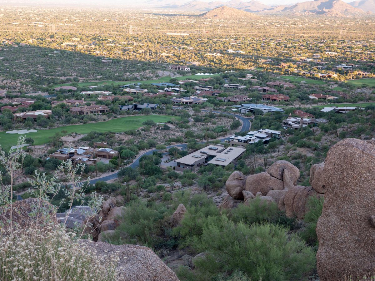 Aerial view of a luxury desert estate at sunset
