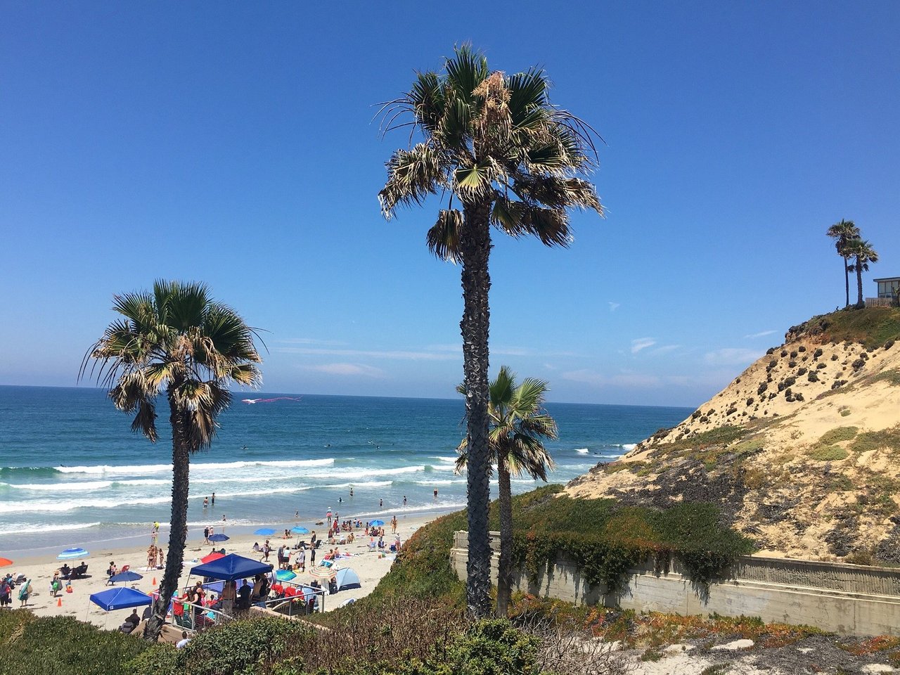 Fletcher Cove Beach Park in Solana Beach featuring the sandy beach, oceanfront park, children's play area, and beautiful Pacific coastline in North County San Diego.