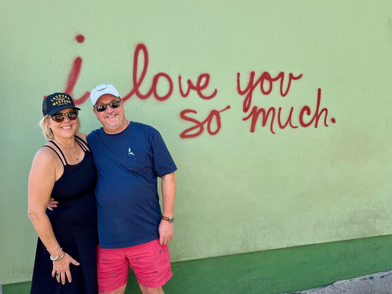 Carrie and Jeff Leinen in front of the I love you so much sign in Austin Texas, Moving to Austin from California