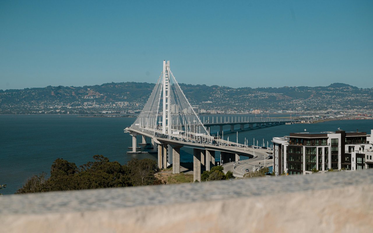 San Francisco Bay Bridge view and waterfront skyline representing San Francisco luxury real estate and Monica Pauli Compass market updates