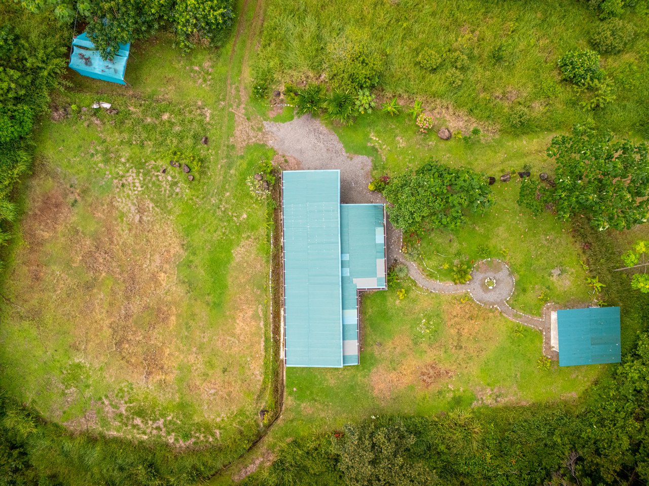 Plant Your Roots at Tierra Bendita! 2.5 Acres, River Frontage, 2 Bedroom Home, Private, Easy Access!