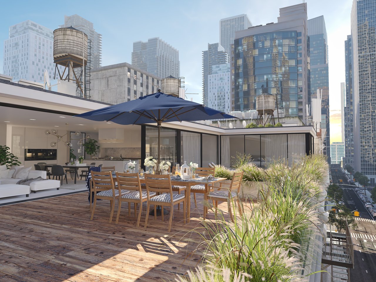 Rooftop terrace with outdoor dining, lounge seating, and a city skyline view.