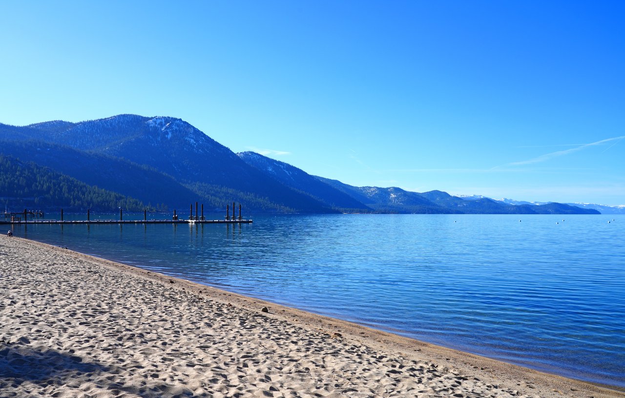 Private IVGID beach on Lake Tahoe at Incline Village, Nevada with sandy shoreline and clear water
