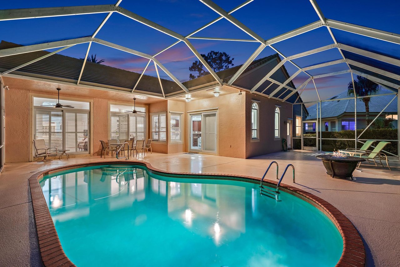Full-house generator and propane tank beside a single-story pool home in North Passage, a gated community near Jupiter and Tequesta, Florida