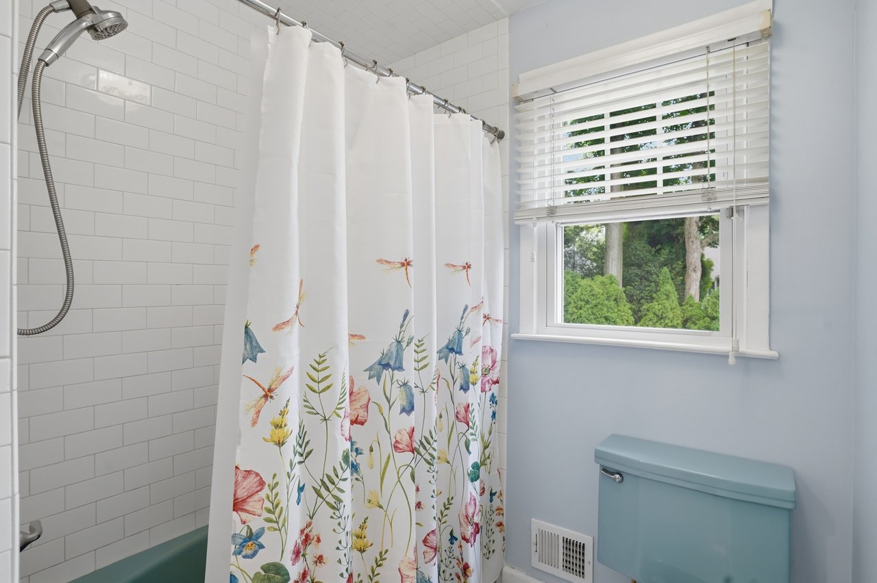 Closer view of tub/shower and toilet