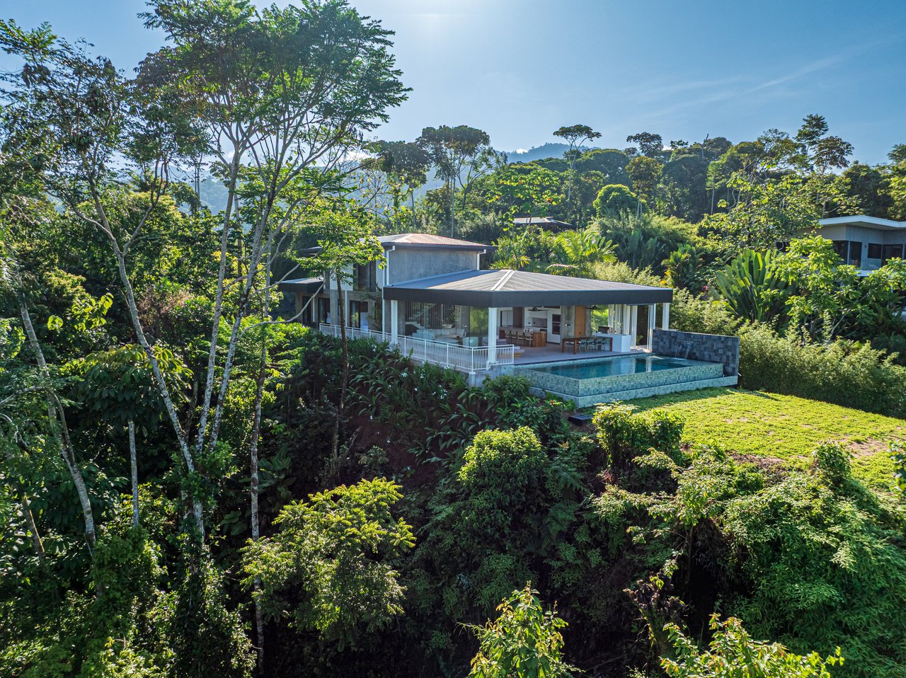 New contemporary tropical villa boasts with a movie theater and views of the iconic whale’s tail