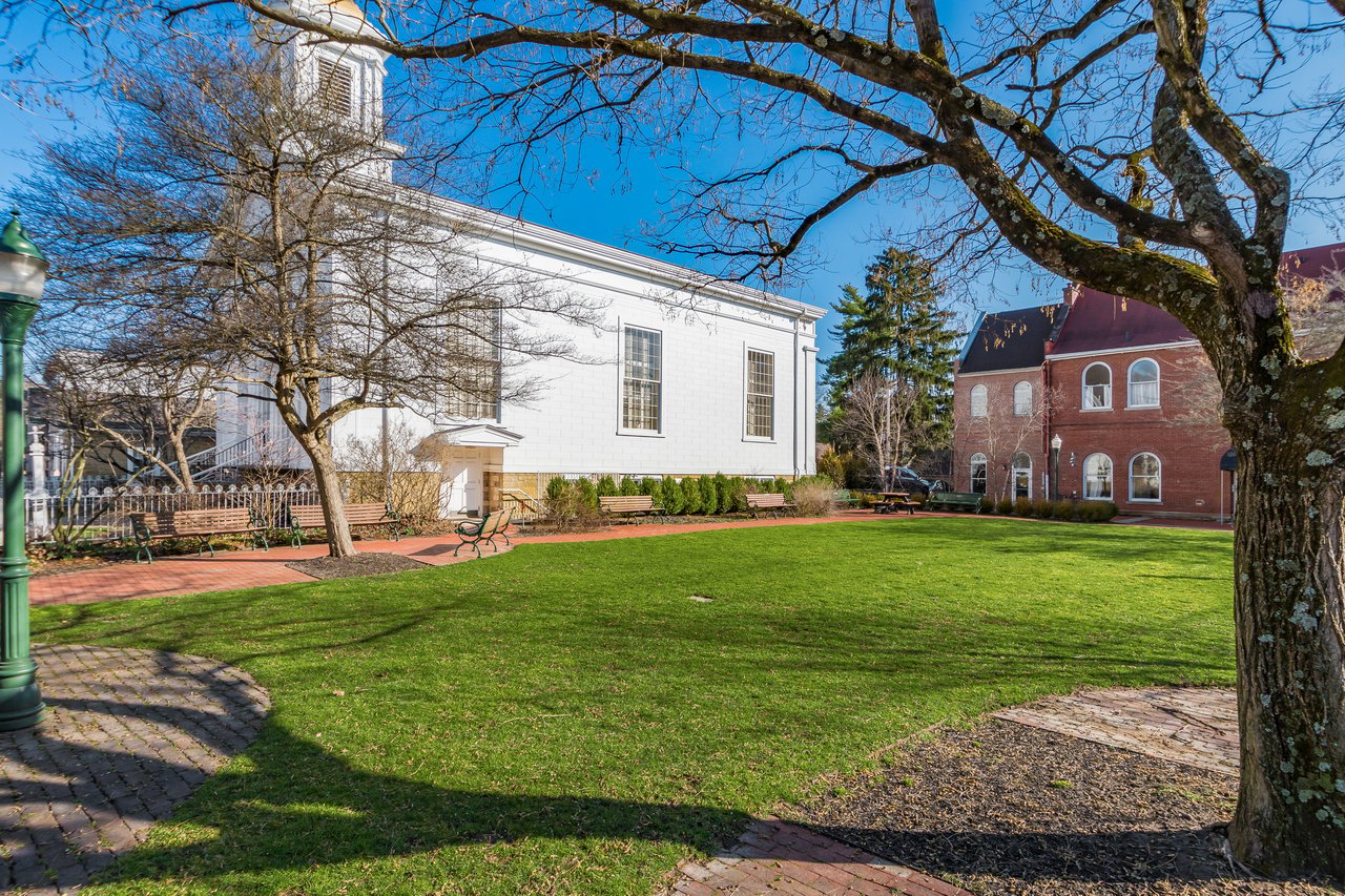 Landscaped village green surrounded by historic buildings in downtown Granville, Ohio