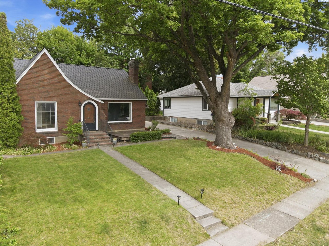 Historic brick home at 620 SE High Street in Pullman WA featuring classic architecture and a beautifully landscaped backyard on Pioneer Hill.