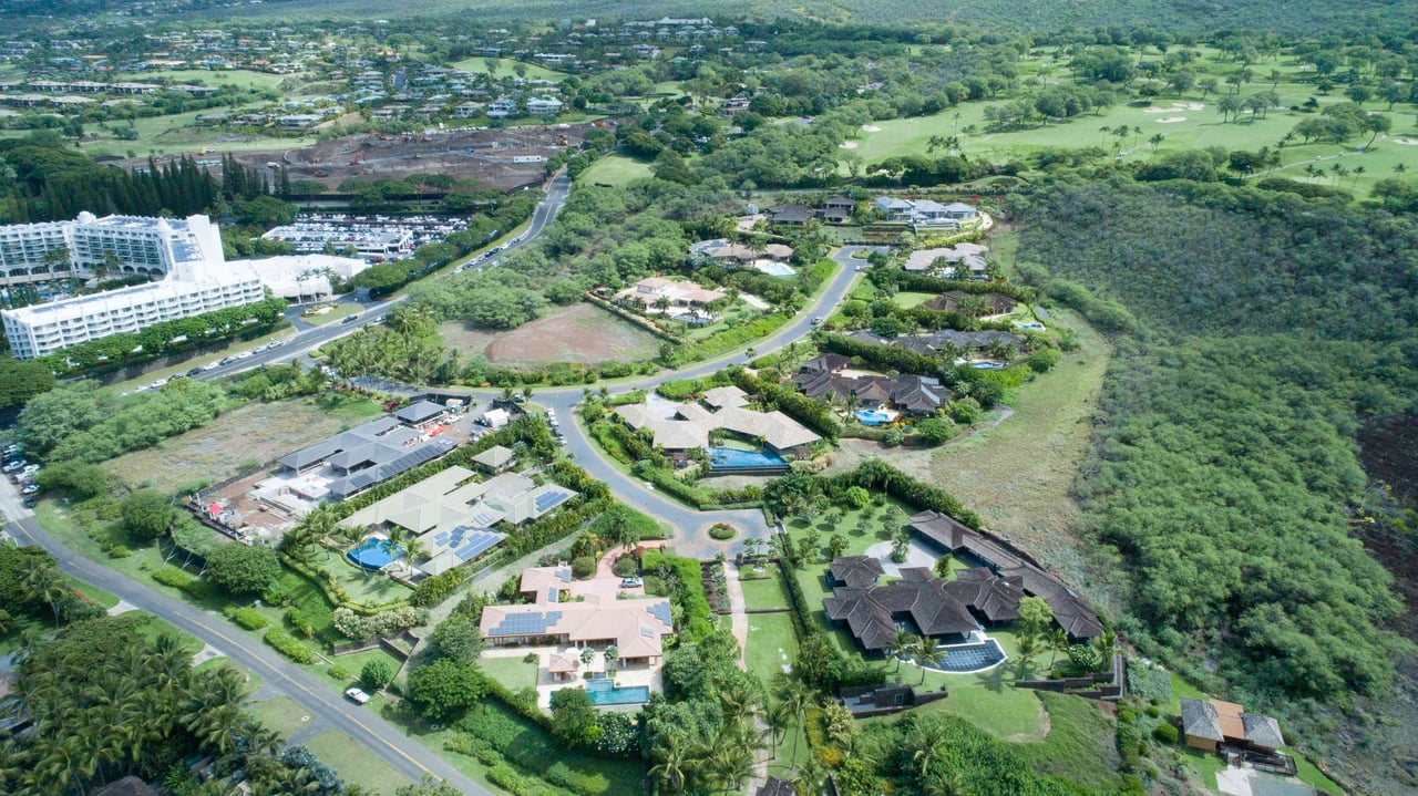 aerial image of one palauea bay in Makena Maui with Fairmont Kea Lani and wailea in background