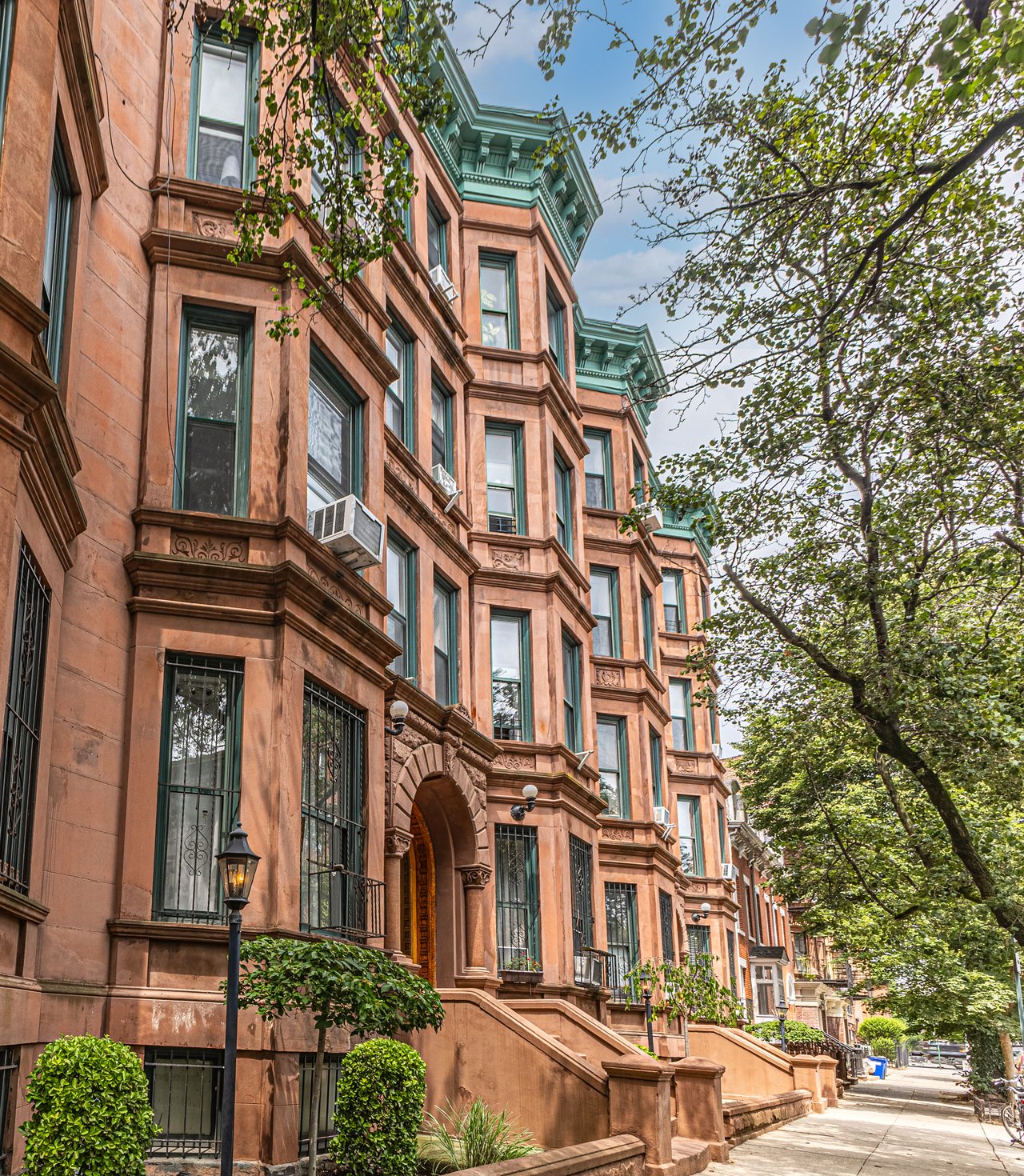 Historic brownstones, townhouses, and multifamily homes along Bainbridge Street in Bedford-Stuyvesant, Brooklyn.