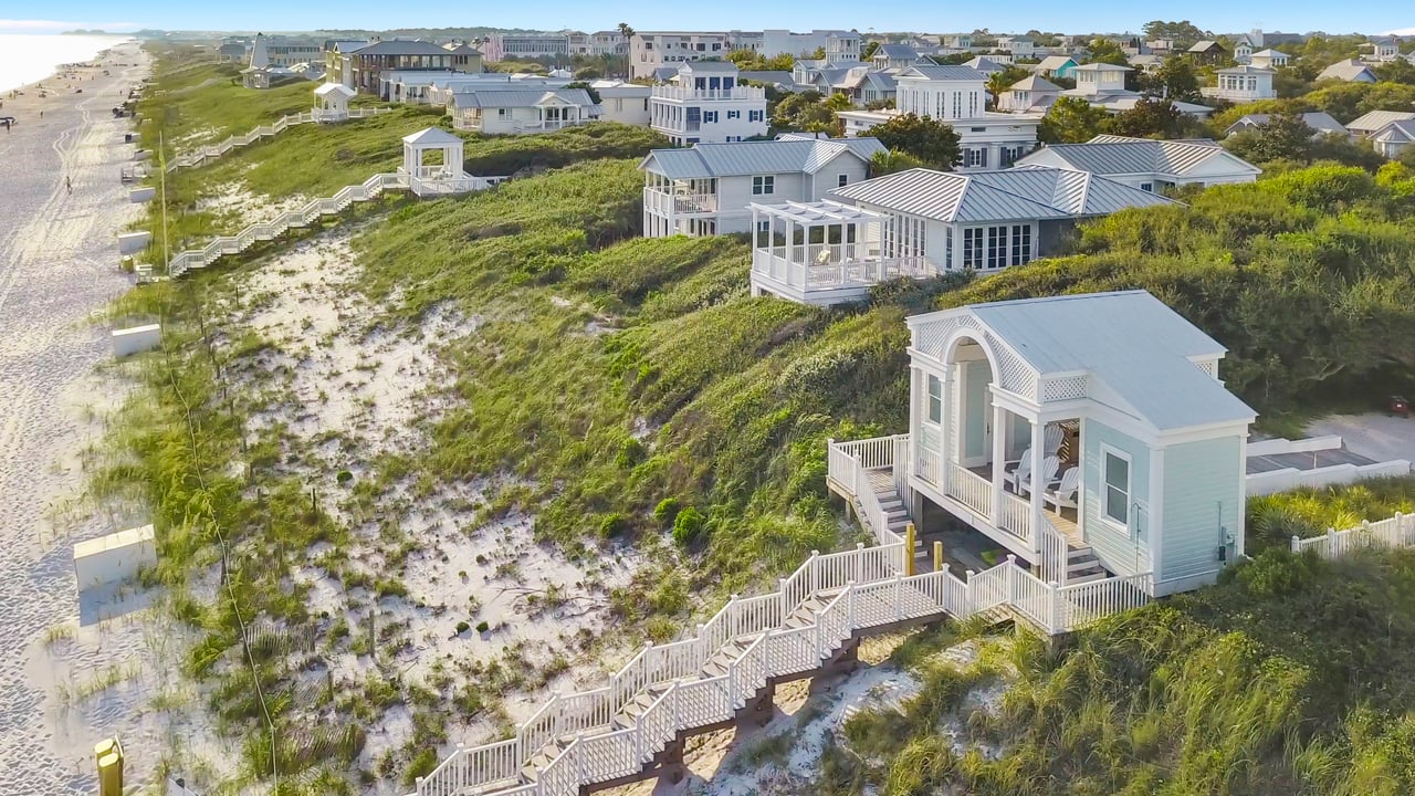 Seaside Florida beach with dune walkovers, white sand shoreline, and Gulf Coast homes along 30A