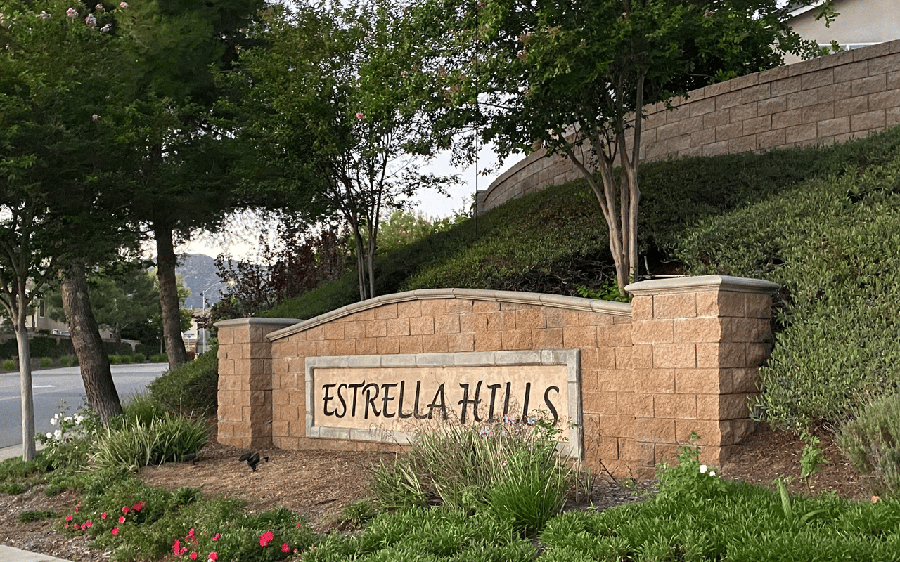 The stone monument entry sign for the Estrella Hills community in Wildomar, California.