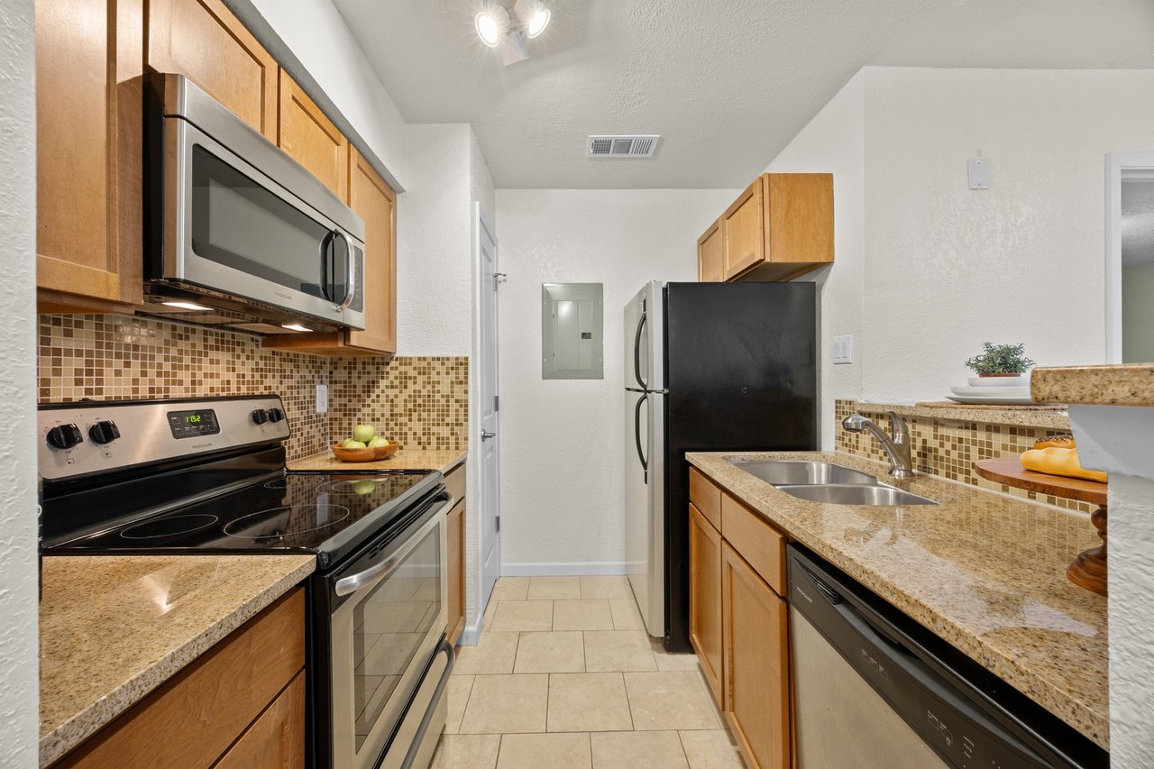 Top-Floor Condo Retreat in Gated Ivy Condos | Private Balcony + Tree-Filled Views