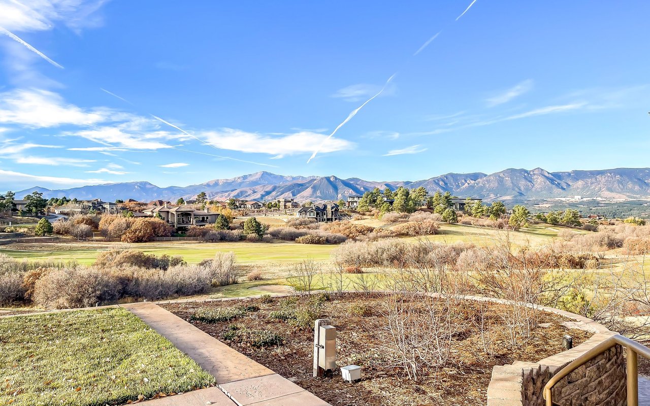 Flying Horse golf course and neighborhood homes with a mountain range beyond.