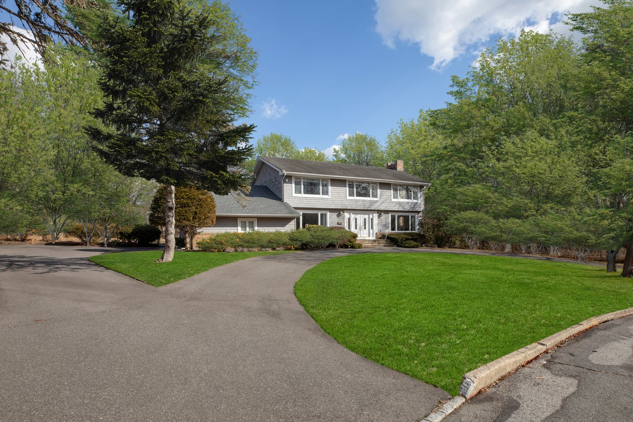 SPACIOUS COLONIAL ON SHY ACRE PROPERTY