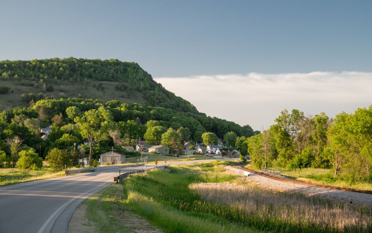 Aerial view of Houston County, Minnesota, highlighting rolling hills, river valleys, and lush farmland, showcasing the area's rural beauty and natural landscapes.
