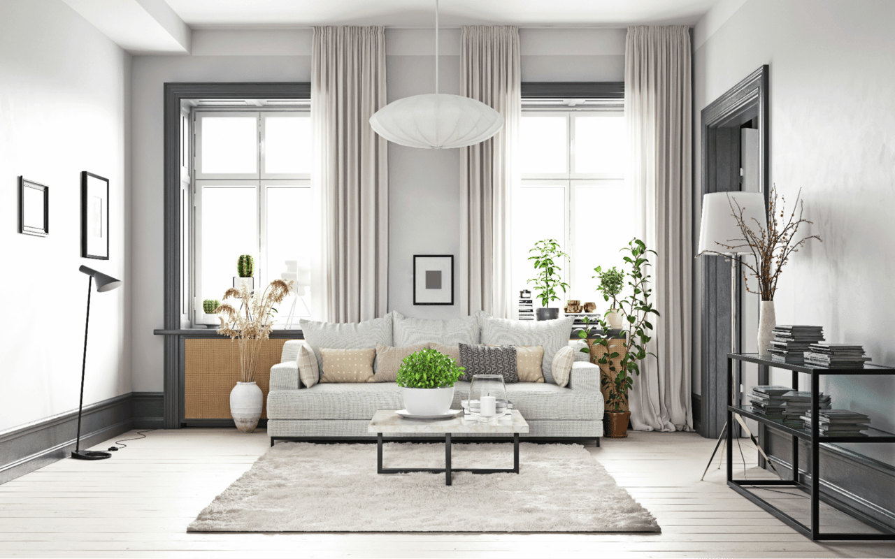  A brightly lit living room features a light-colored sofa centered on a plush,