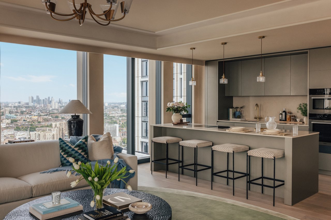 Open-plan living room and kitchen with a large island and views across the London skyline.