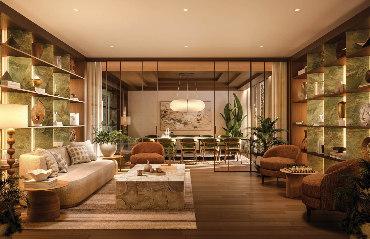Furnished living room with sculptural stone coffee table, built-in shelving, and dining area beyond.