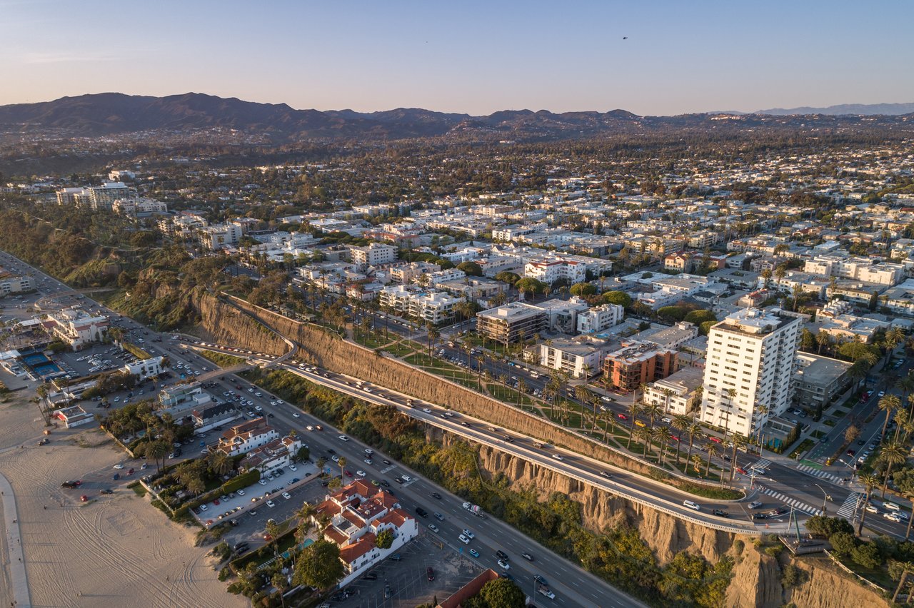 Aerial panorama of Mar Vista, with neighborhood streets and buildings stretching toward distant mountains.