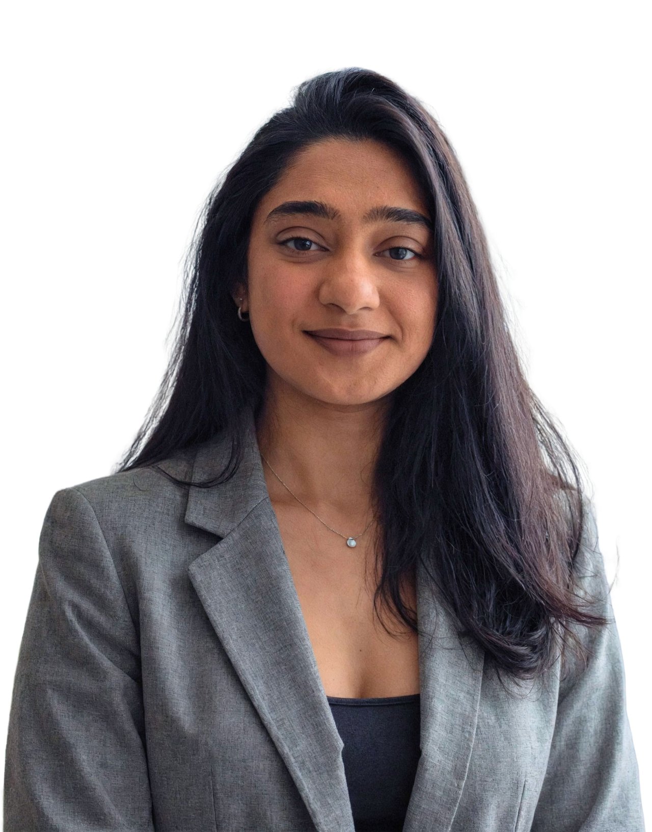 Steffi Castelino in a gray blazer against a white background.