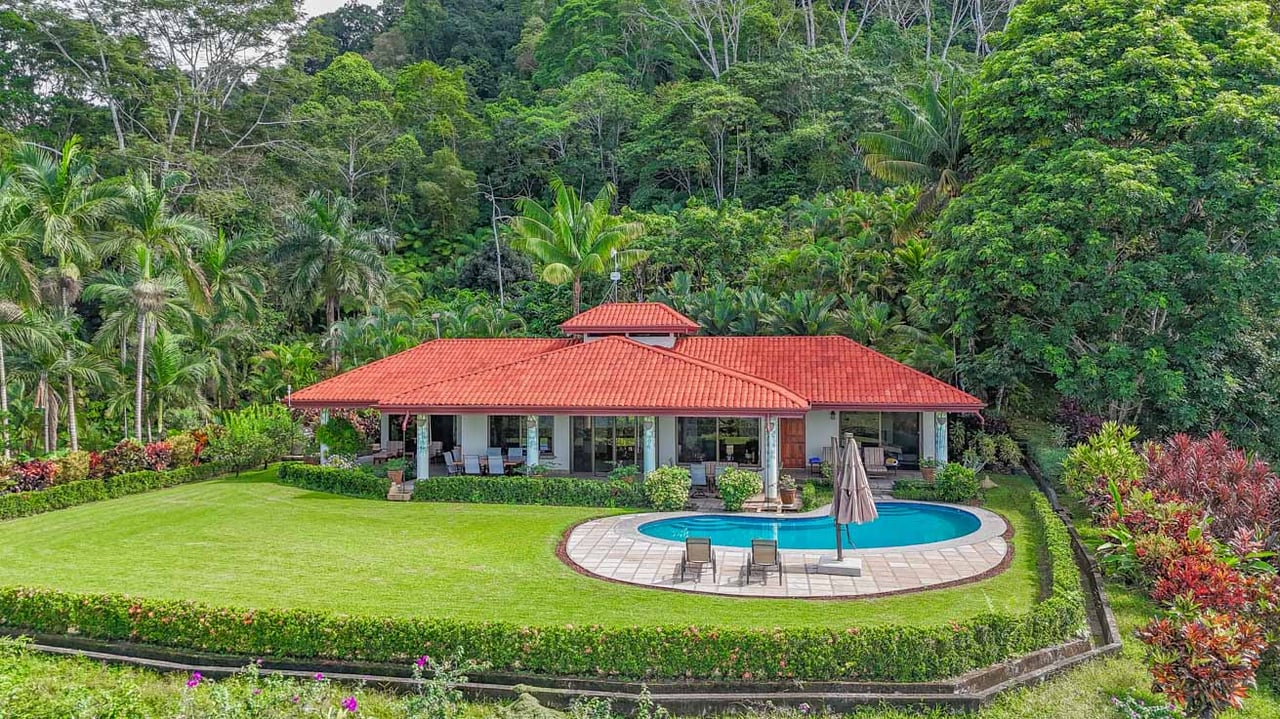 Ocean, jungle & mountain views on a meticulously landscaped 3-home family compound