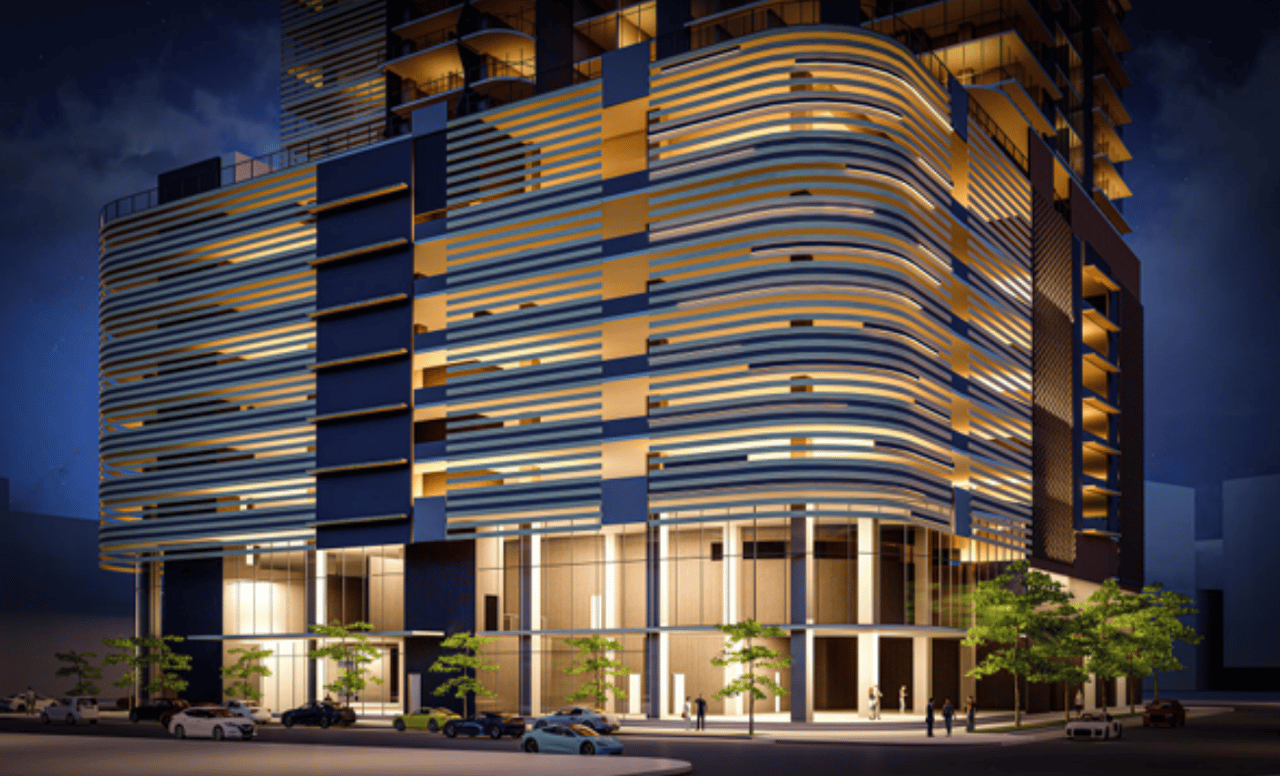 rendering of the exterior of hotel ora tampa from the ground floor at night