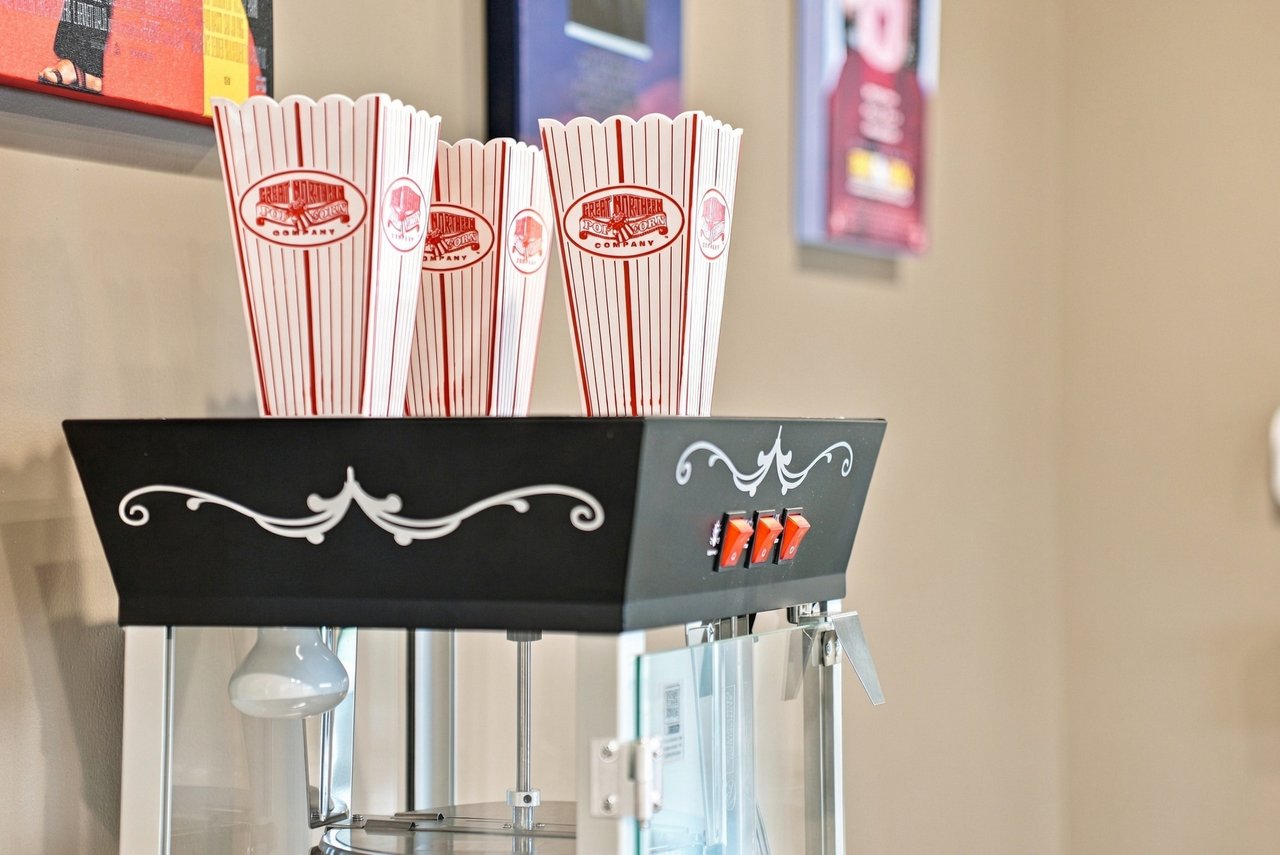 Popcorn machine with striped Great Northern Popcorn Company bags.
