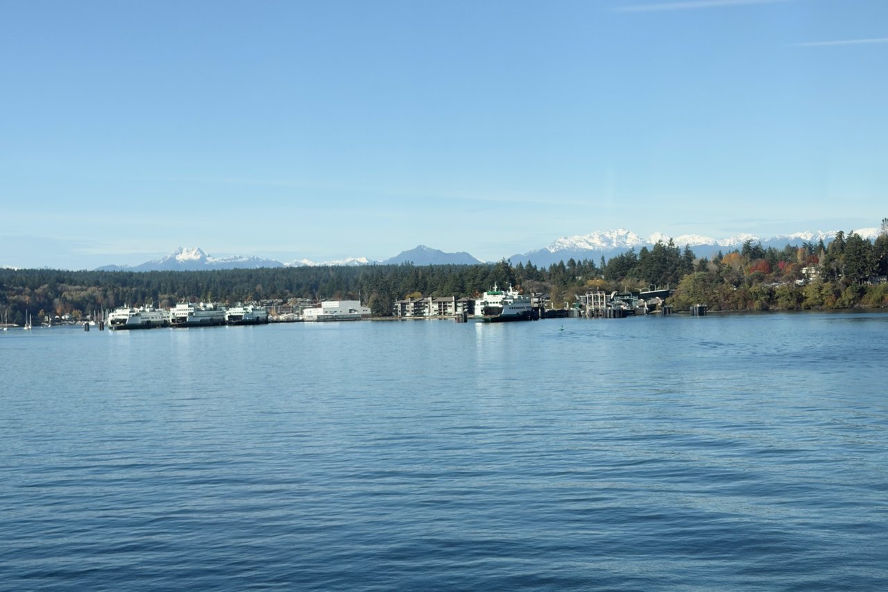 Eagle Harbor waterfront view from Bainbridge Island ferry terminal with Olympic Mountains in background
