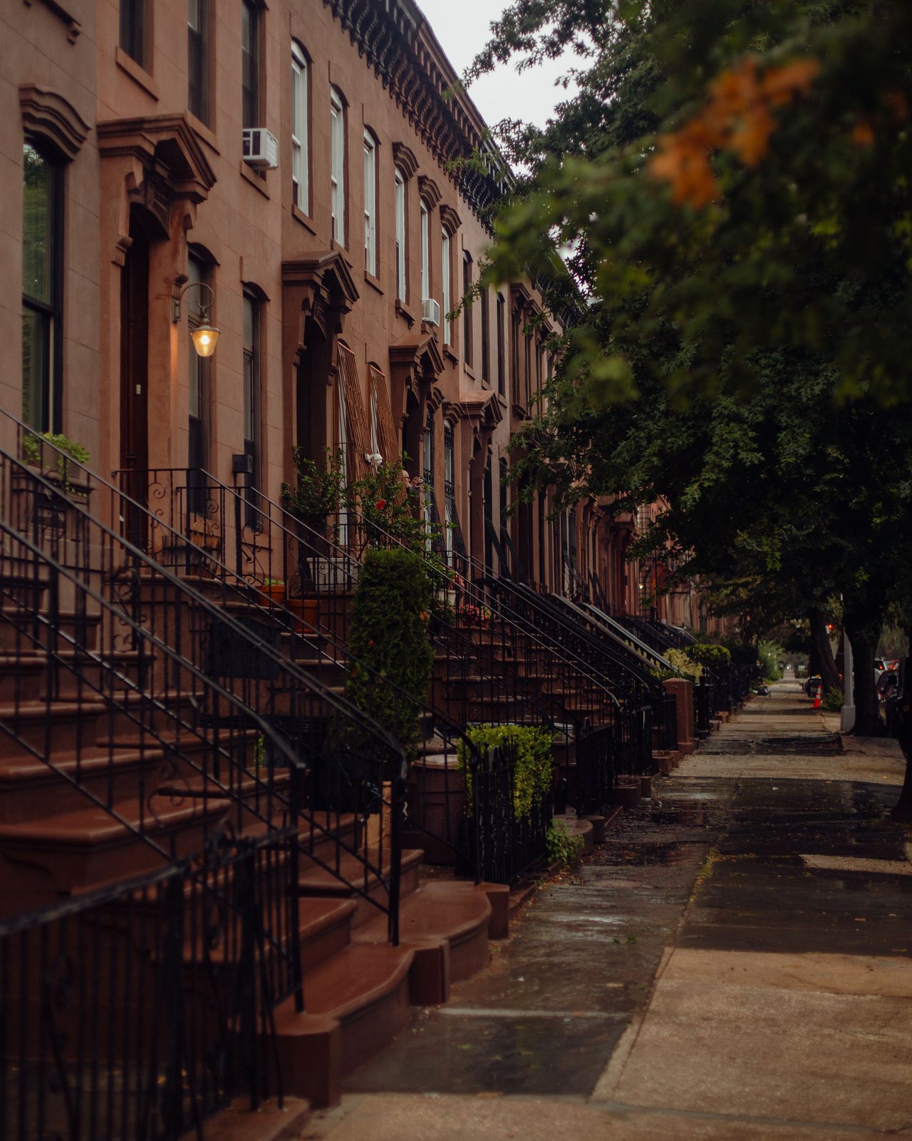 Historic brownstones, elegant townhouses, tree-lined blocks, and boutique condominiums along Henry Street in Carroll Gardens, Brooklyn.