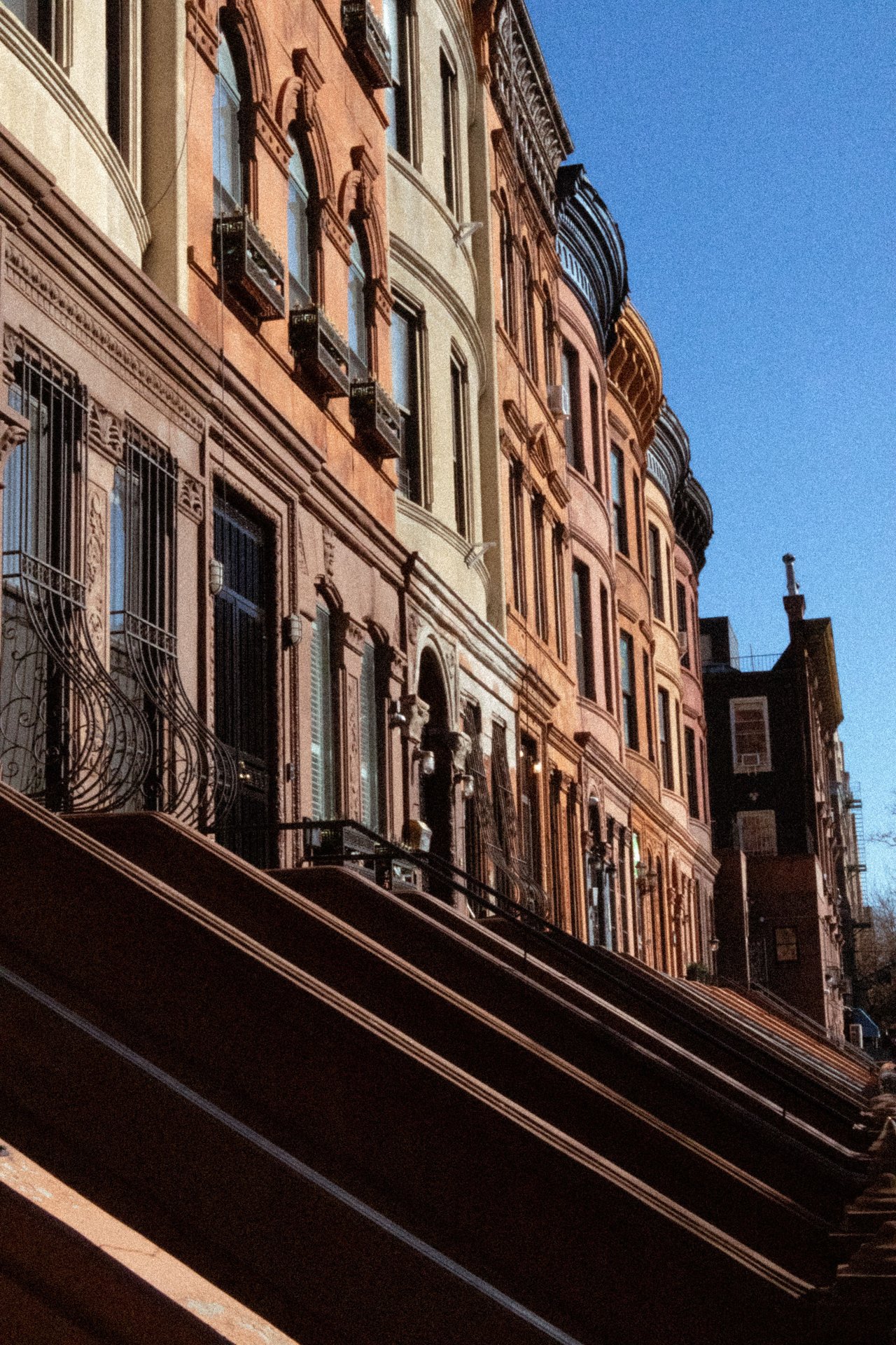 Historic brownstones and limestone townhouses along 6th Street in Park Slope, Brooklyn