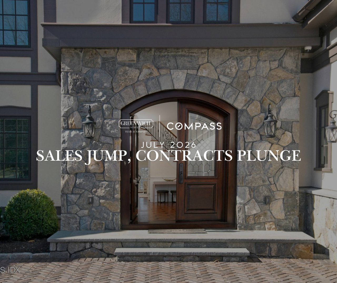 Stone arched entrance of a luxury Greenwich CT home, Greenwich Streets July 2026 real estate market report on record sales and historic low inventory.