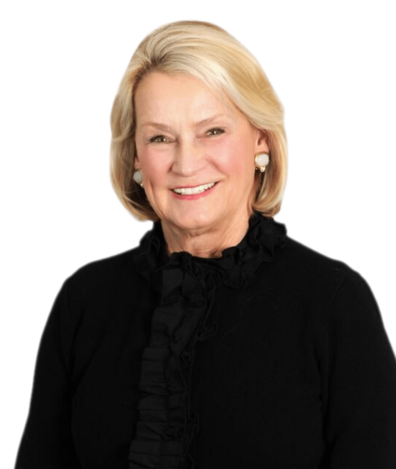 Joanne Shakley smiling in a black blouse with pearl earrings.