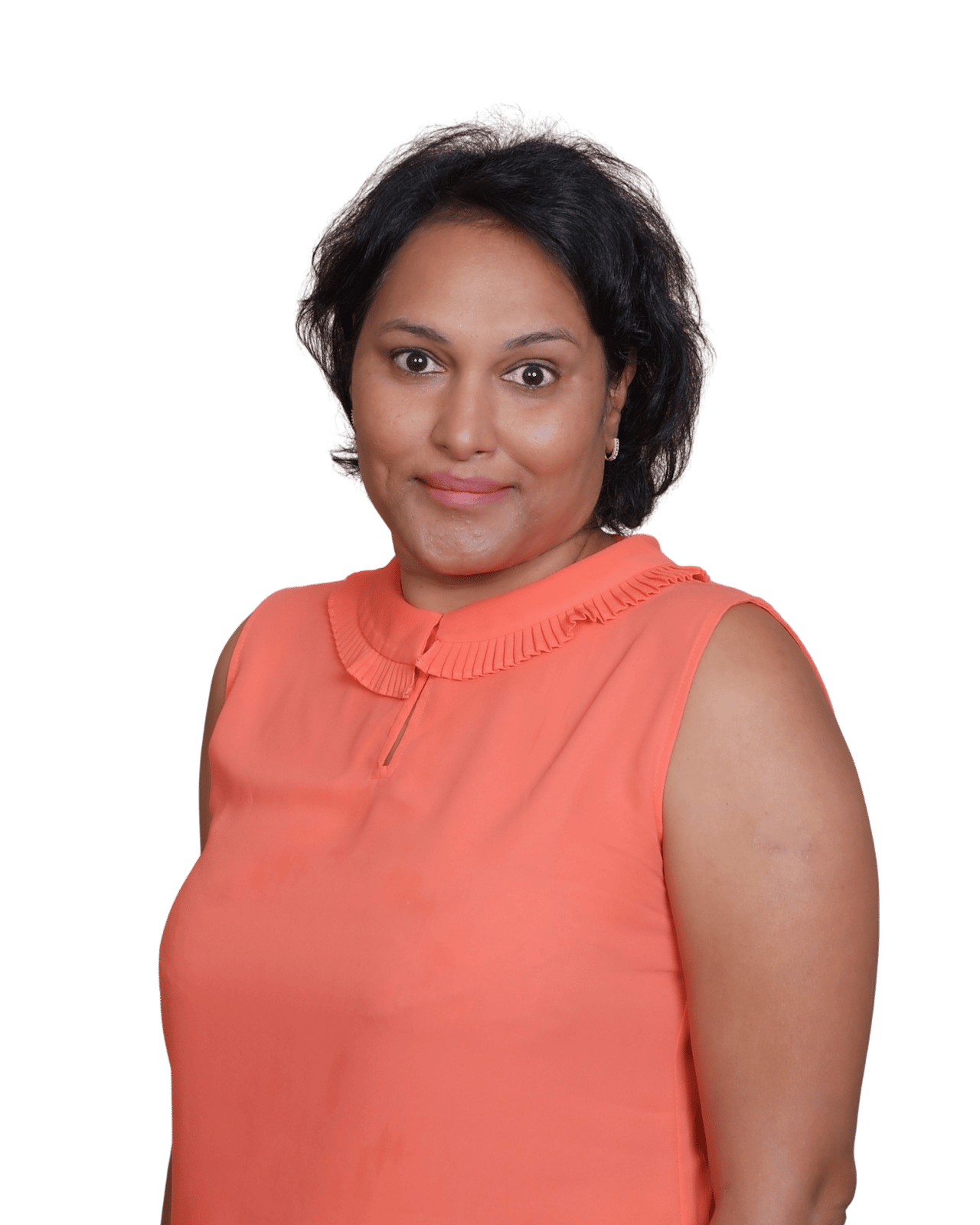 Jayshree Reddy smiling in a coral sleeveless blouse.