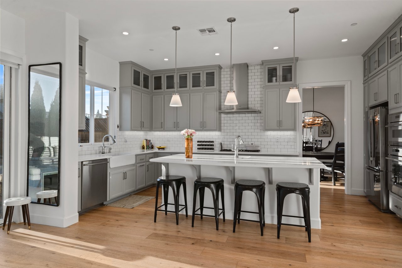 Open-concept dining space with Shaker-style cabinetry and natural light
